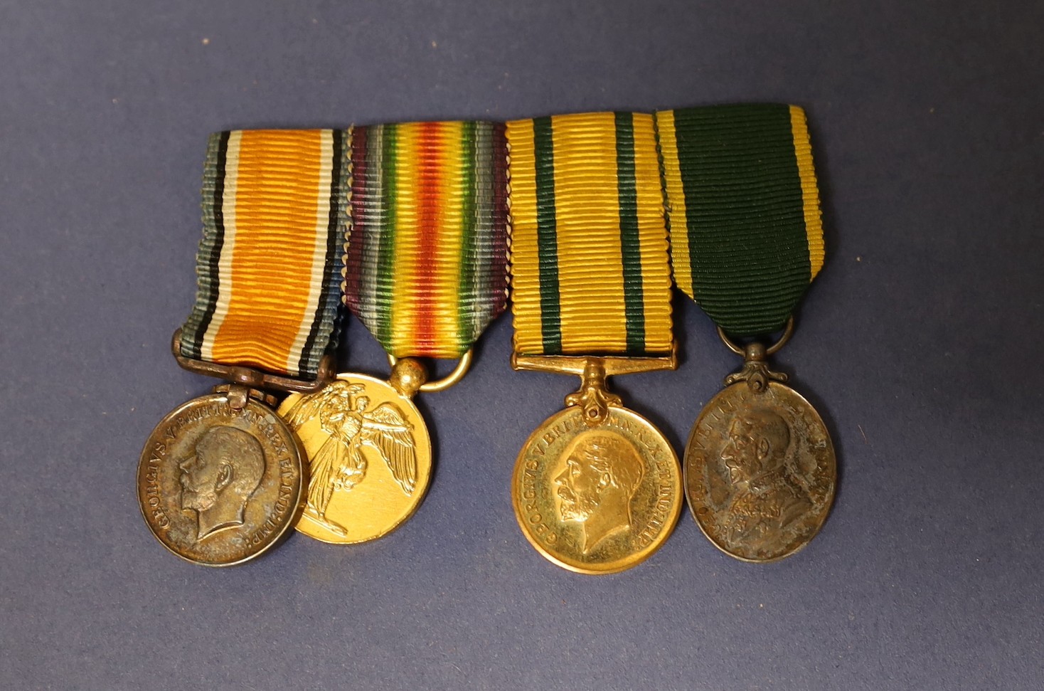 Two WWI family medal trios to 9098 Pte. A Paterson 2/R Scots. including Mons star and to 11619 Pte. A Paterson S. Gds. with miniature medals etc.